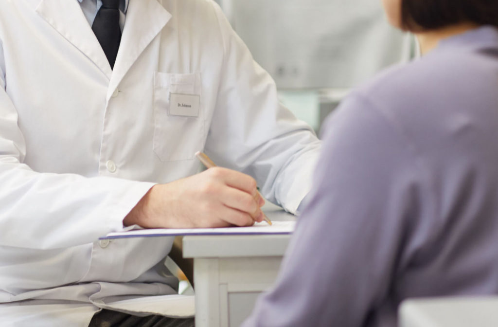 A woman revisits her eye doctor to get a new prescription of her contact lenses or eye glasses.