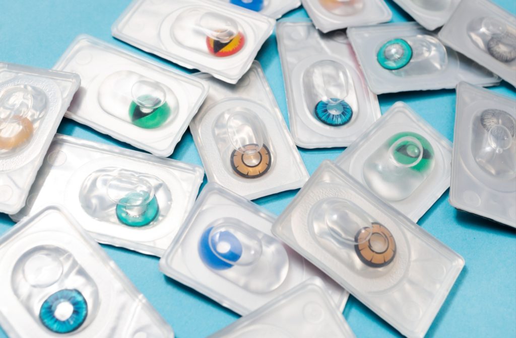 A close-up showing a variety of different colored contact lenses in their packaging.