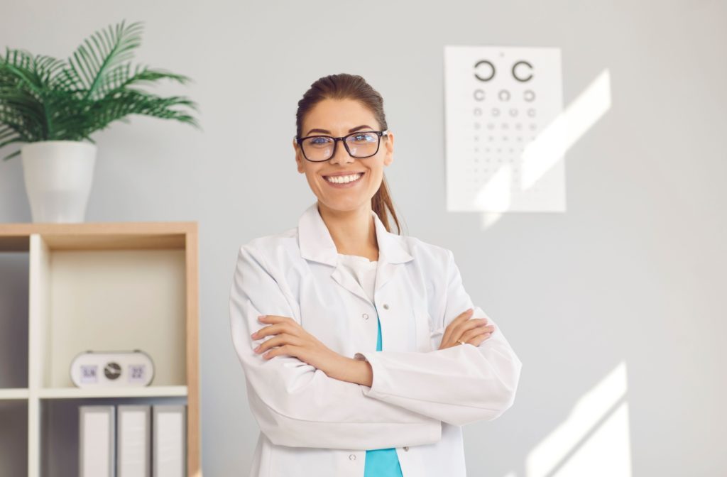 A happy optometrist smiles in their exam room.